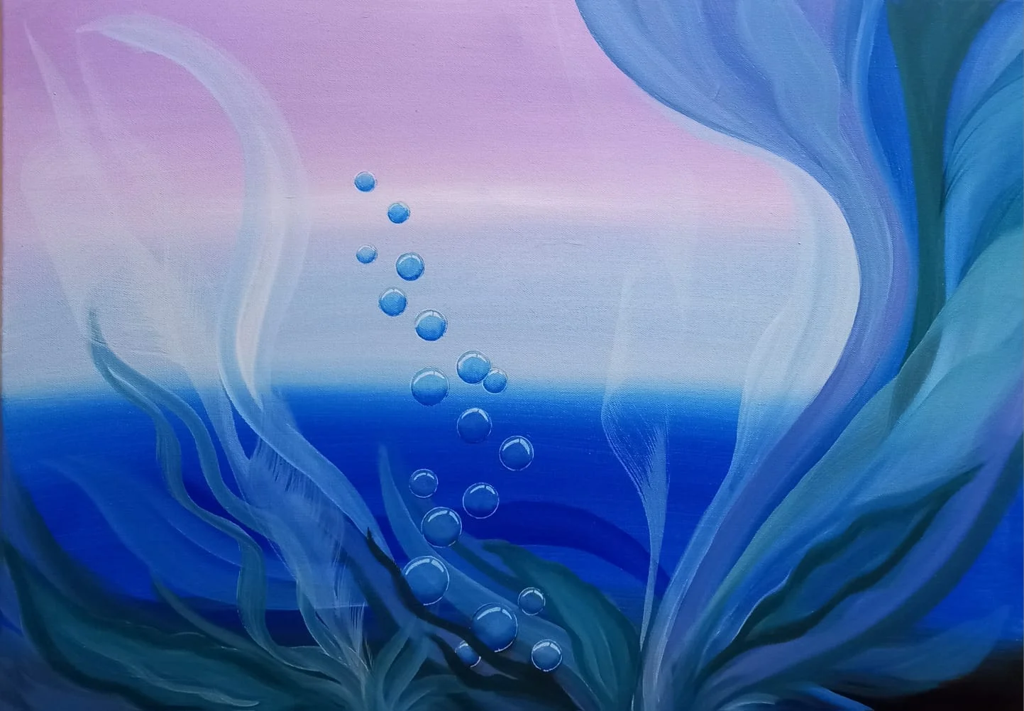Bubbles rising through deep blue water under a pink sky
