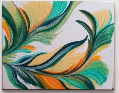 Green and yellow feather-like leaf on a white ground
