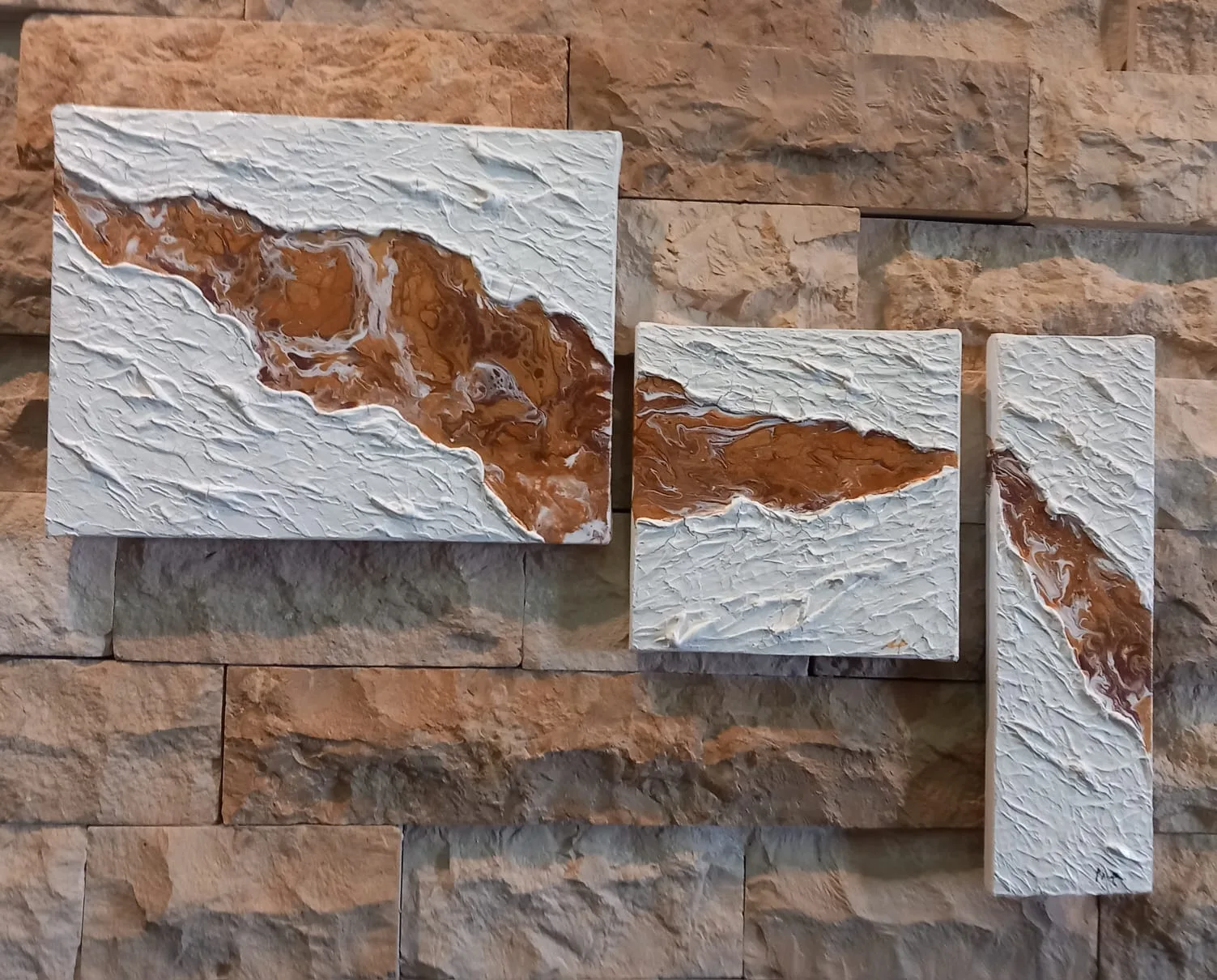 White textured panels with a brown river running through