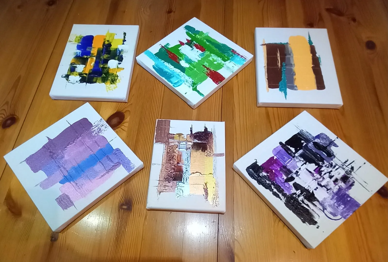 Six small colourful abstract panels